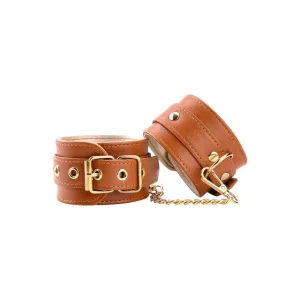Cătușe DREAMTOYS Blaze Elite Handcuffs. pentru jocuri erotice. din piele ecologică. cu lanț auriu. culoare maro coniac